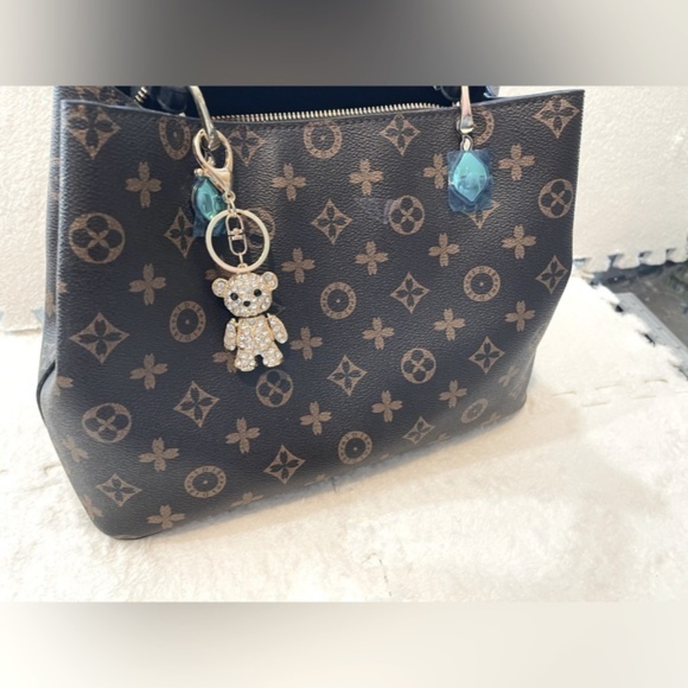 Golden Teddy Bear charm for luxury designer handbags.